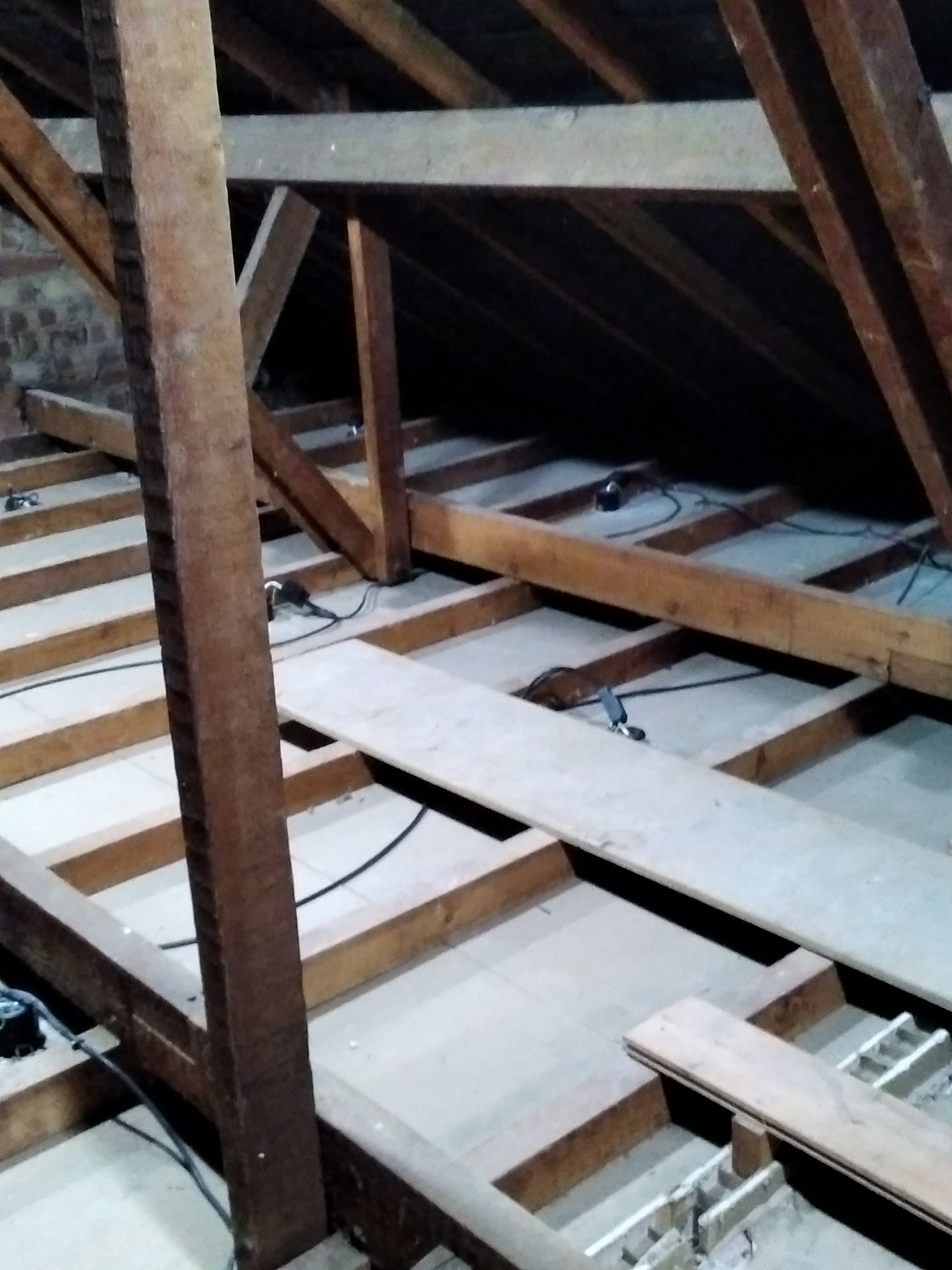 Picture shows an uninsulated loft space