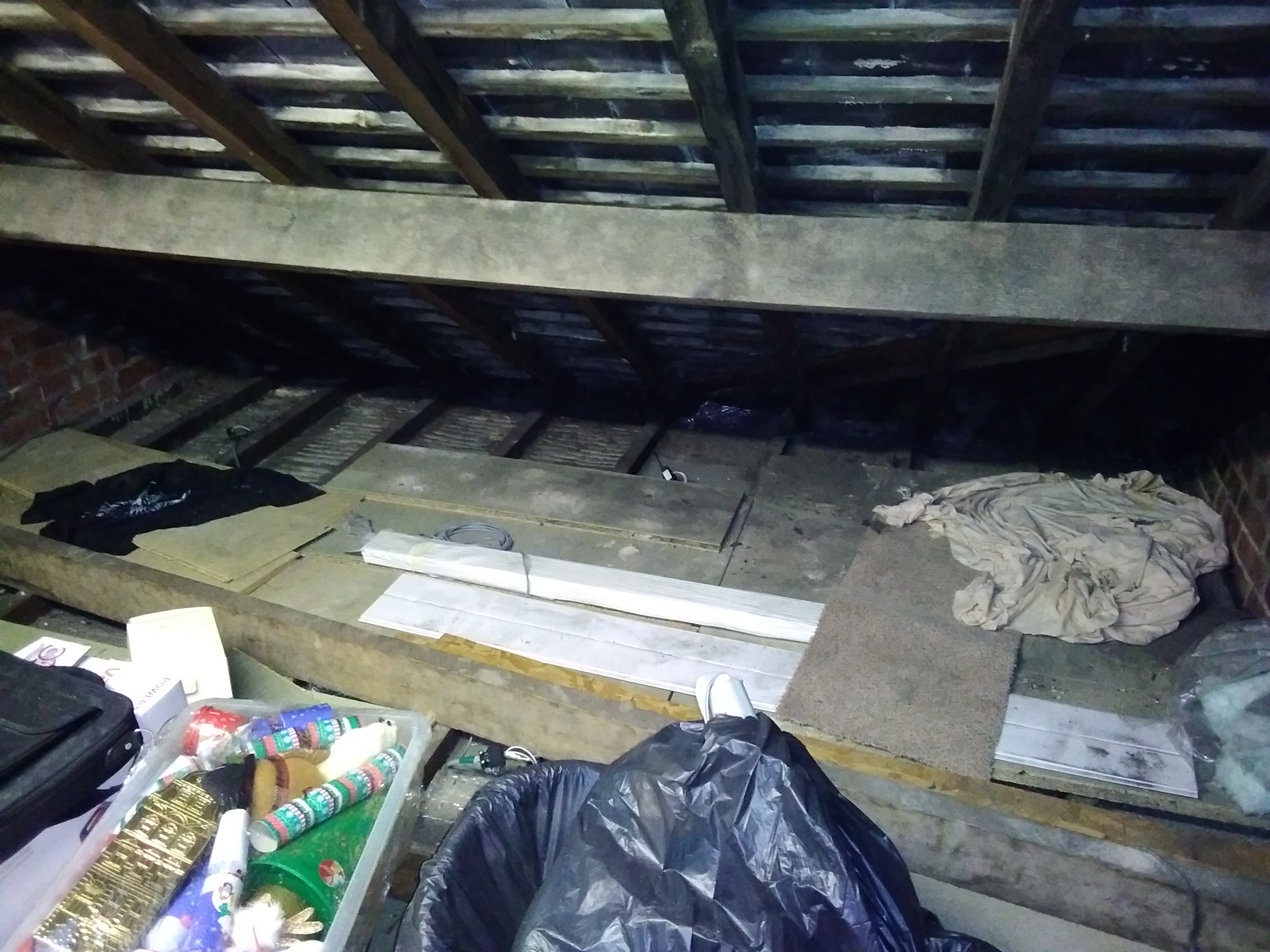Uninsulated loft with unsafe boarding